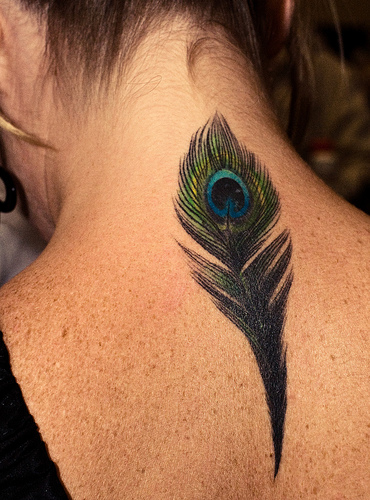 tattoo feather. Tramp Stamp tattoos.